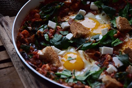 Shakshuka with eggplant, paprika and feta cheese